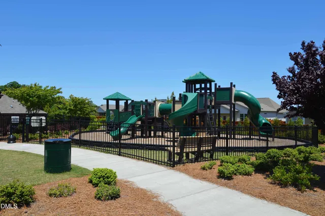 a view of a swimming pool with sitting area and furniture