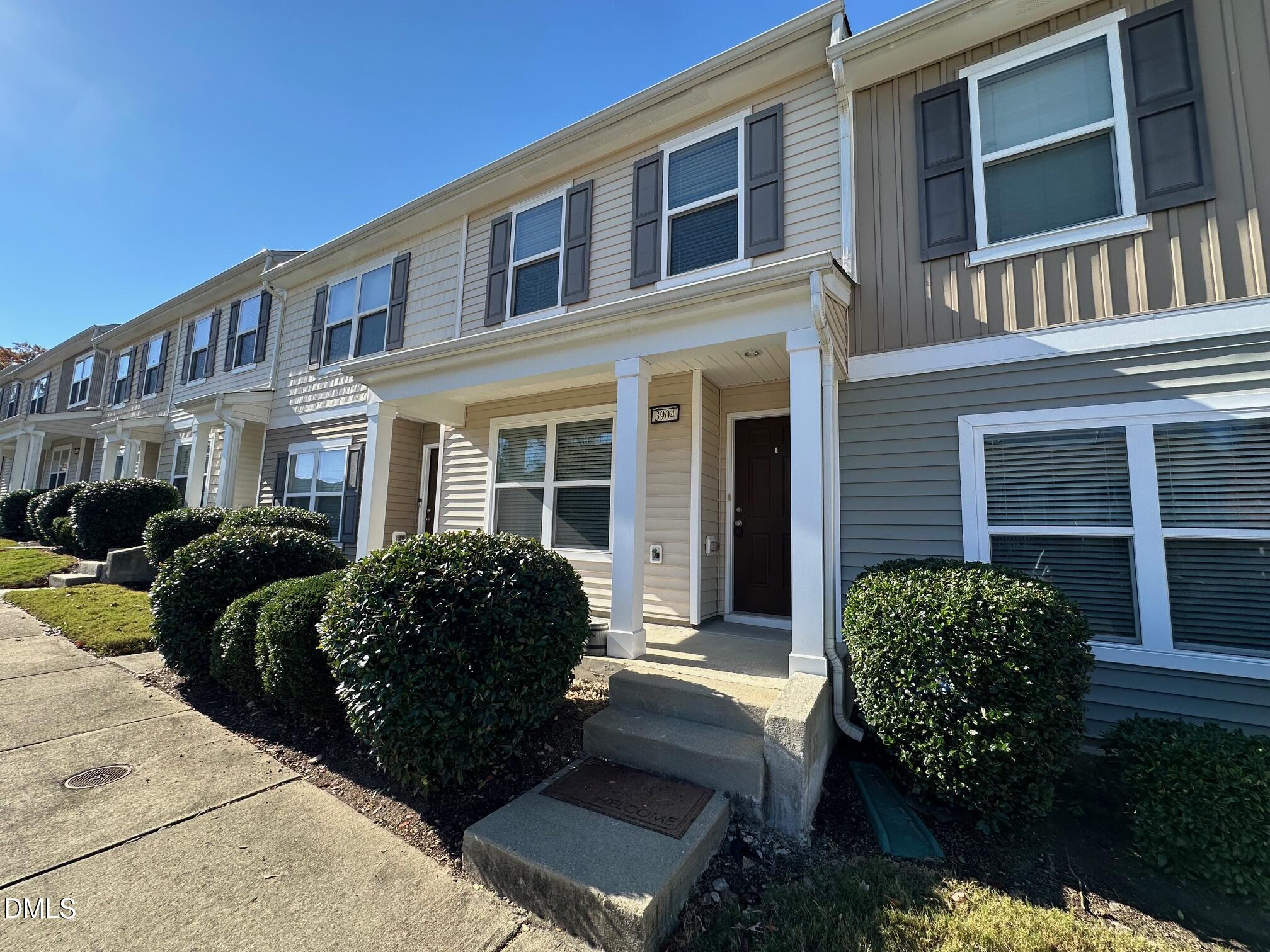 3904 Swinton Street Raleigh, NC 27616 - Photo 2 of 20 a view of a brick building next to a yard