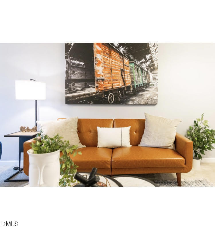 3904 Swinton Street Raleigh, NC 27616 - Photo 4 of 20 a living room with furniture and wooden floor