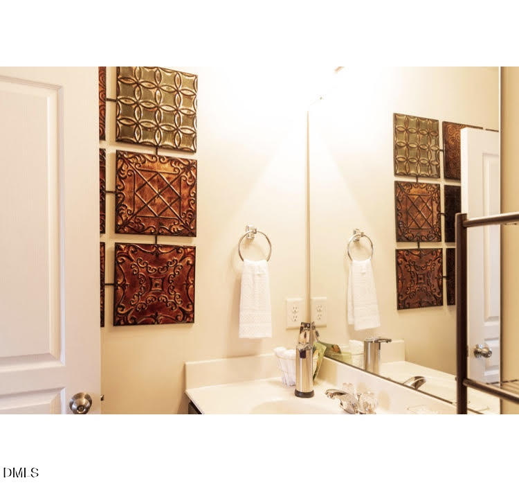 3904 Swinton Street Raleigh, NC 27616 - Photo 7 of 20 a bathroom with a bathtub and a sink