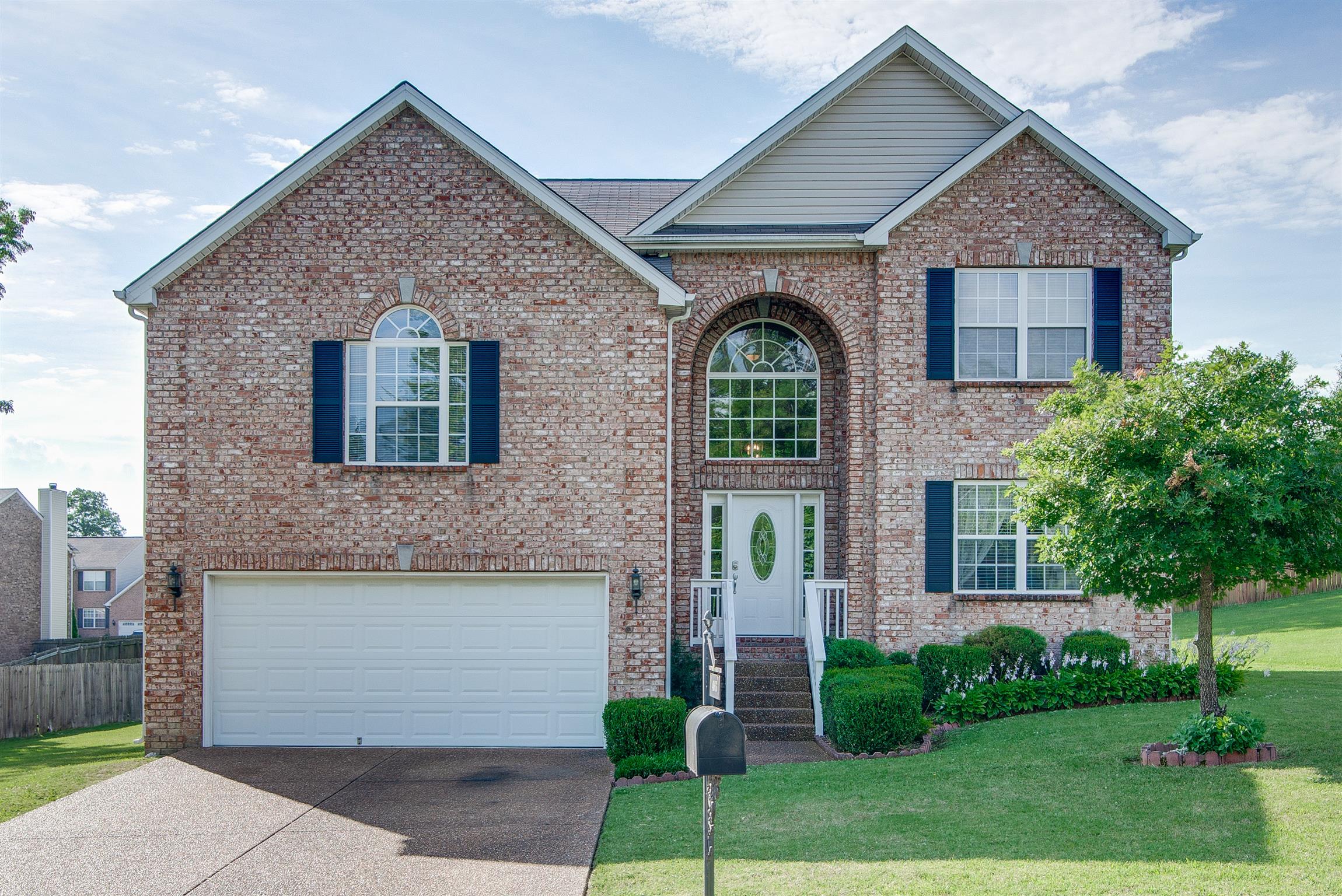 4003 Timber Ridge Court Mount Juliet, TN 37122 - Photo 1 of 1 a front view of a house with a garden