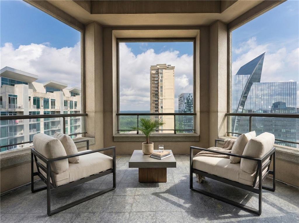 3376 Peachtree Road Northeast, Unit 35A Atlanta, GA 30326 - Photo 3 of 23 a living room with furniture and a floor to ceiling window