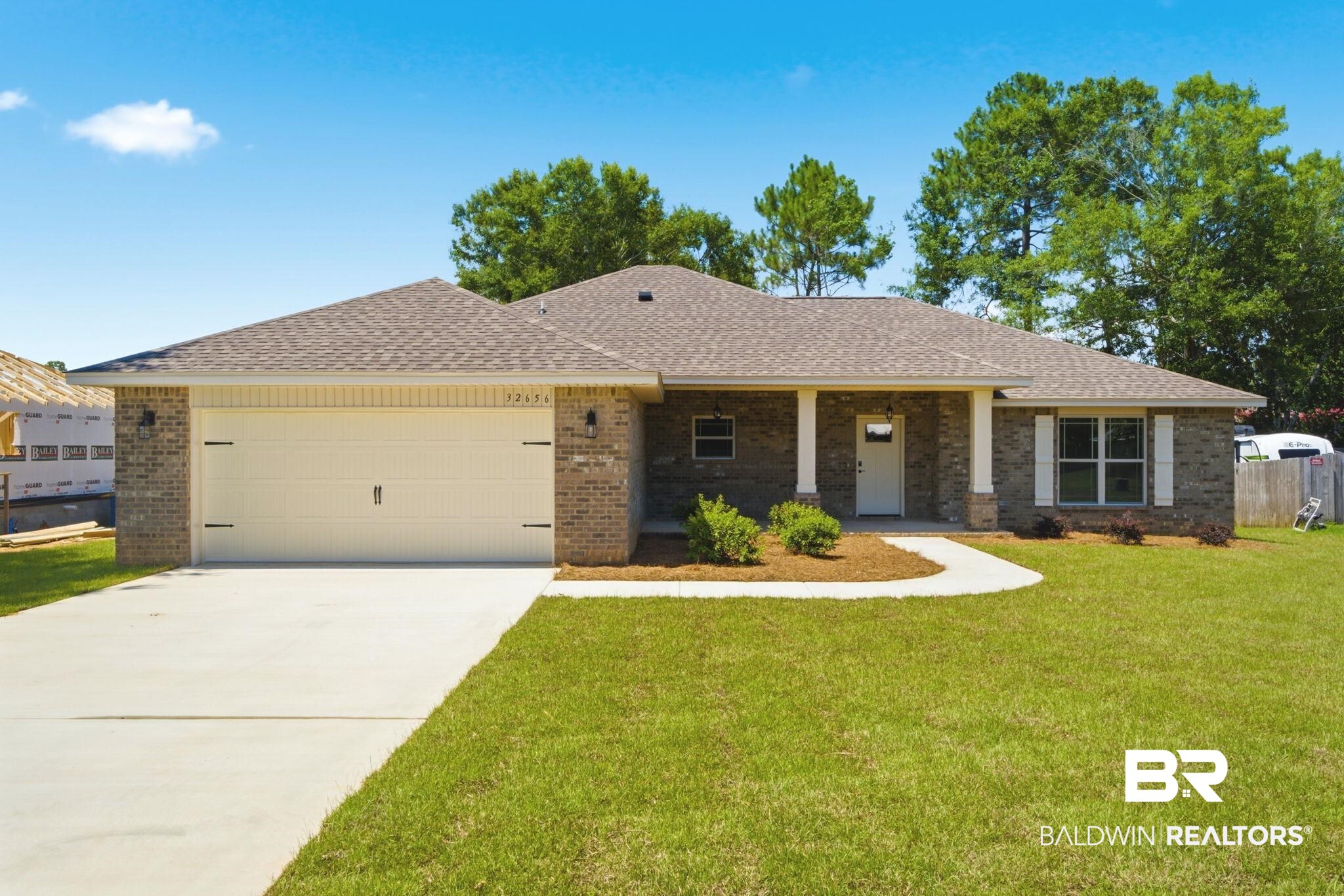 32656 Arbor Ridge Circle Lillian, AL 36549 - Photo 1 of 56 Brick exterior with a single-car garage and a concrete driveway