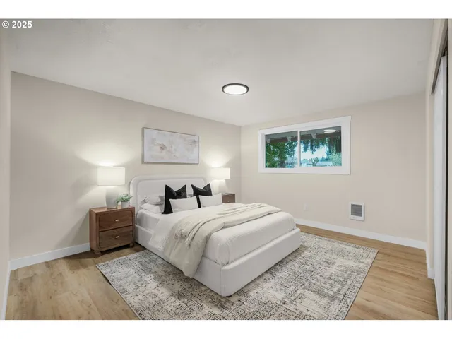 a bedroom with a bed and a lamp