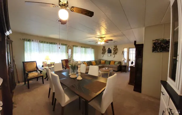 a view of a dining room with furniture