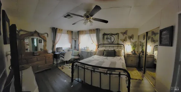 a bedroom with furniture and a window