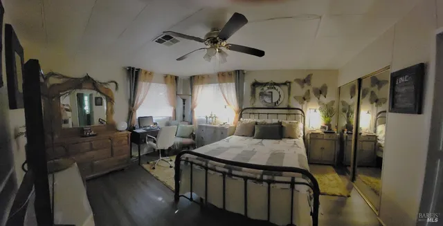 a bedroom with furniture and a window