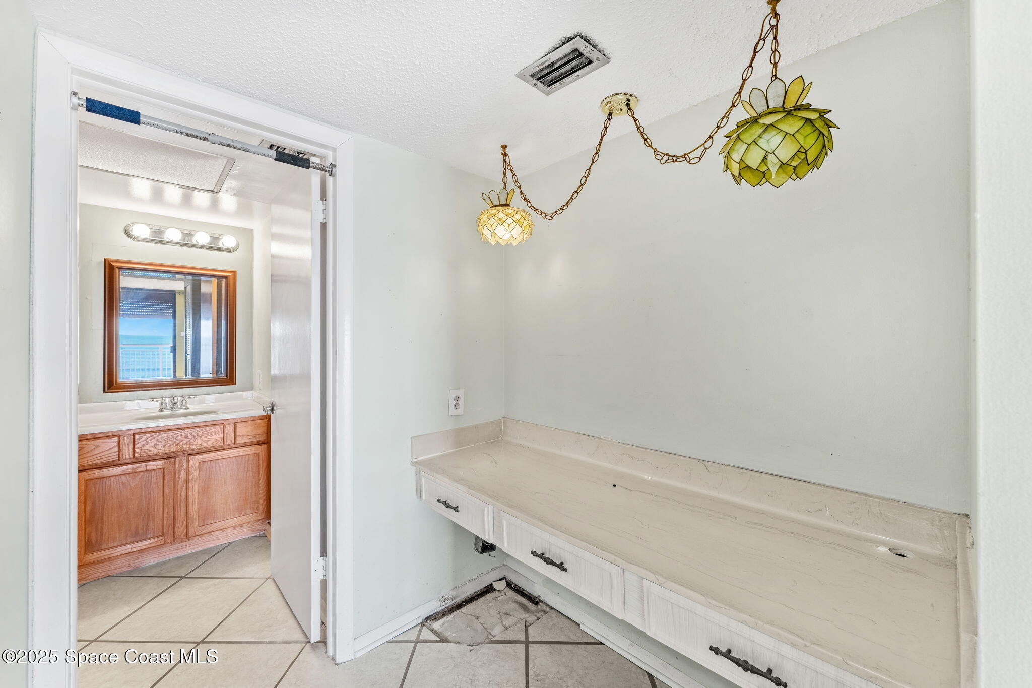 877 N Highway, Unit 904 Indialantic, FL 32903 - Photo 16 of 42 a bathroom with a granite countertop sink and a window