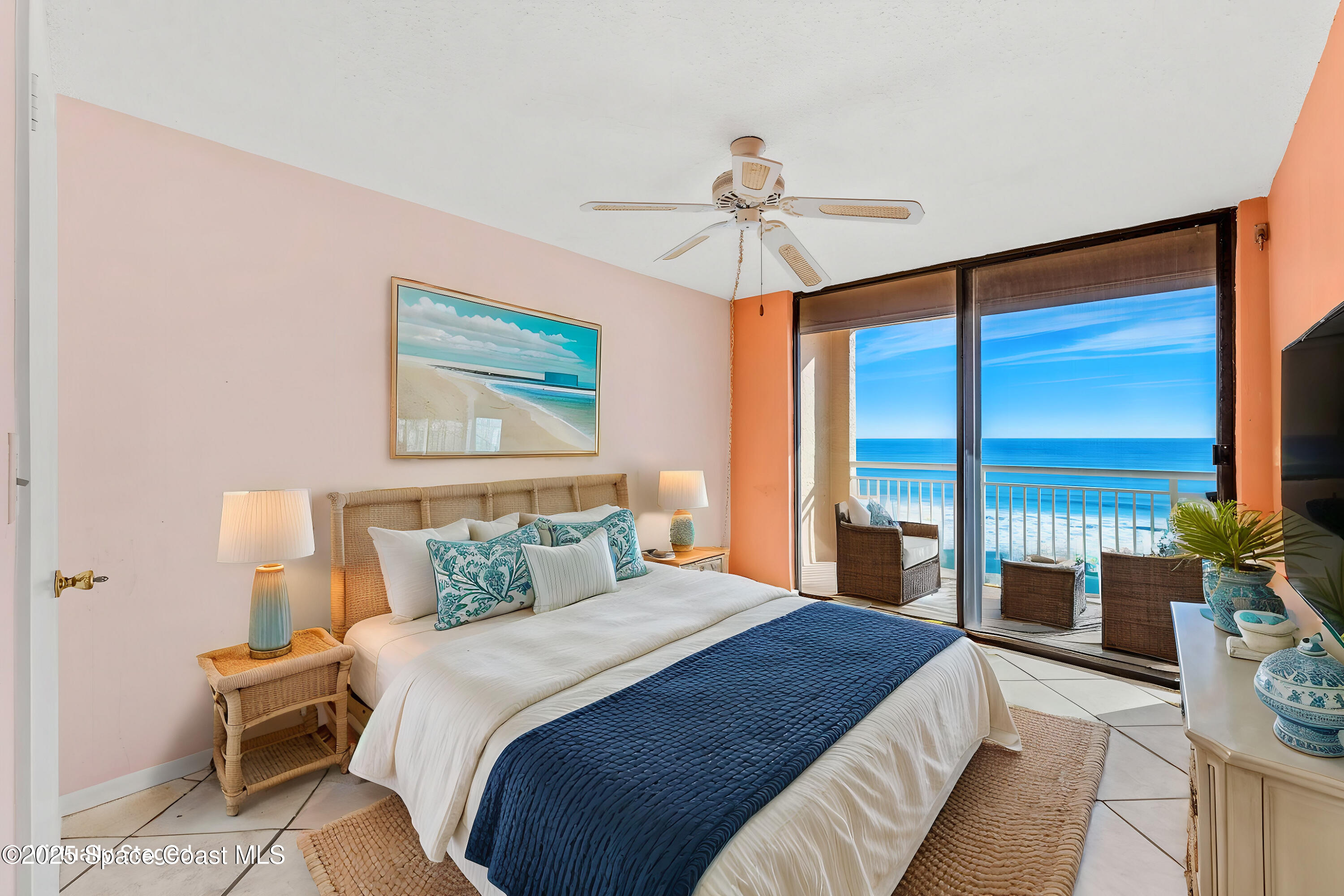 877 N Highway, Unit 904 Indialantic, FL 32903 - Photo 19 of 42 a bedroom with a large bed and a chandelier