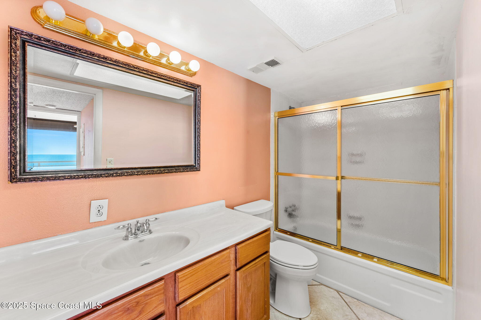 877 N Highway, Unit 904 Indialantic, FL 32903 - Photo 23 of 42 a bathroom with a sink a toilet and shower