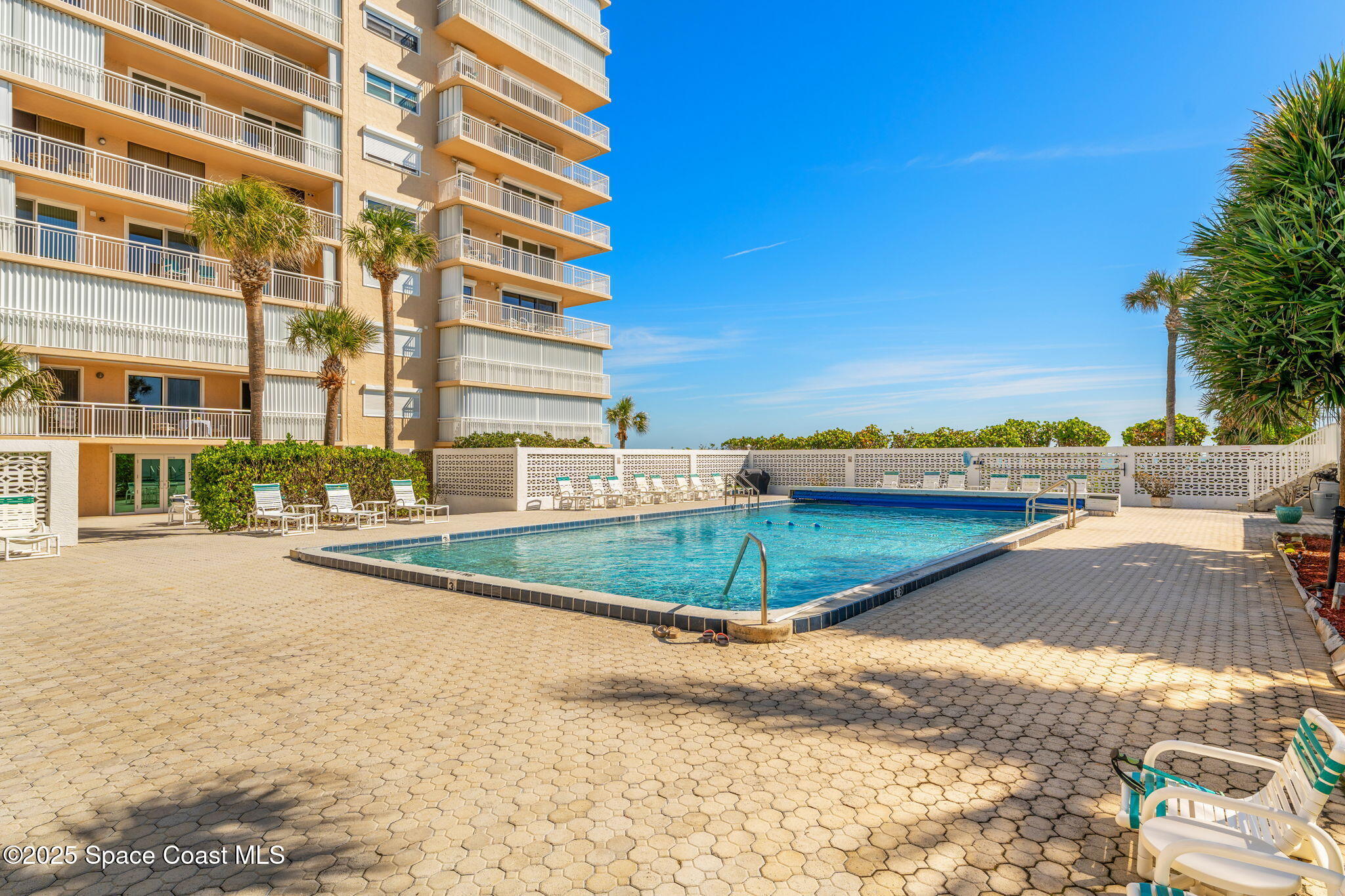 877 N Highway, Unit 904 Indialantic, FL 32903 - Photo 29 of 42 a view of a swimming pool next to a building