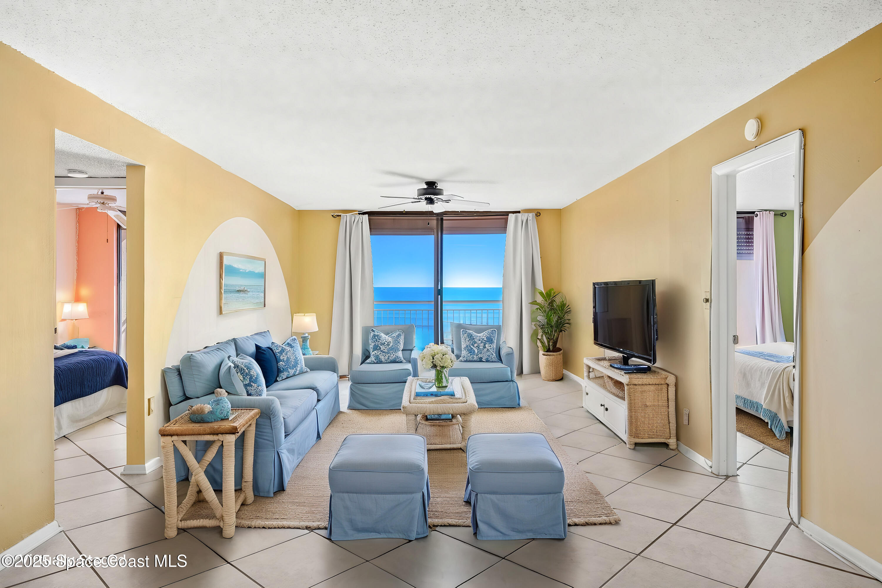 877 N Highway, Unit 904 Indialantic, FL 32903 - Photo 3 of 42 a living room with fireplace furniture and a flat screen tv