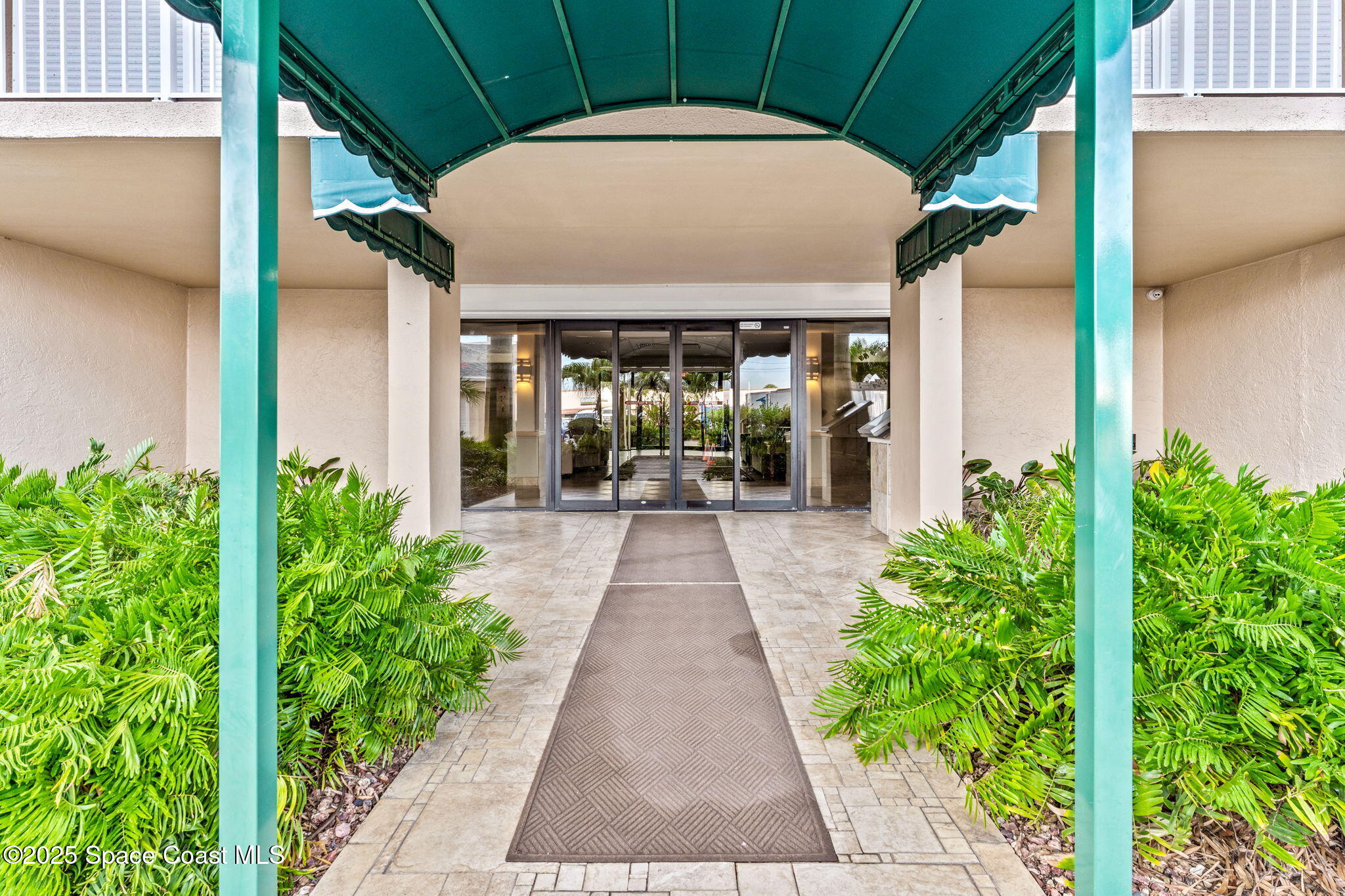 877 N Highway, Unit 904 Indialantic, FL 32903 - Photo 36 of 42 a view of a pathway with a flower garden