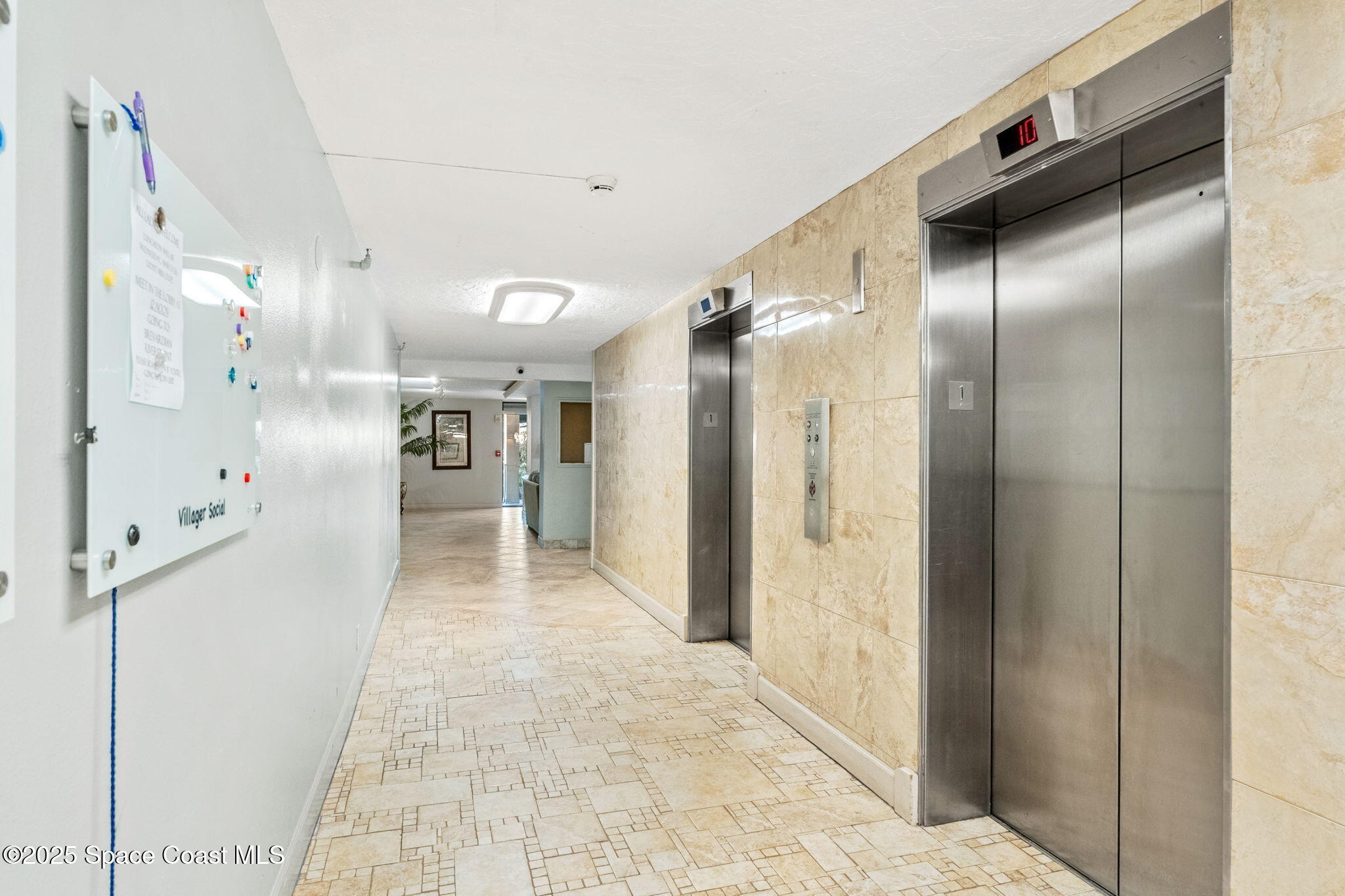 877 N Highway, Unit 904 Indialantic, FL 32903 - Photo 37 of 42 a bathroom with a glass shower door