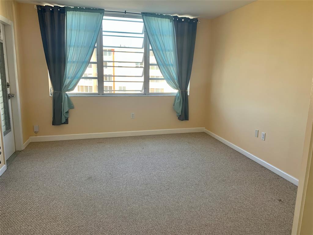 1710 Northeast 191st Street, Unit 4123 Miami, FL 33179 - Photo 11 of 17 an empty room with a window