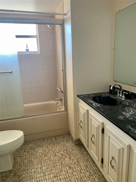 1710 Northeast 191st Street, Unit 4123 Miami, FL 33179 - Photo 14 of 17 a bathroom with a granite countertop bathtub sink toilet and shower