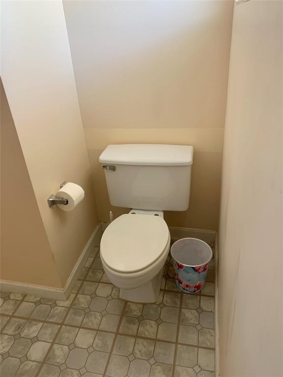1710 Northeast 191st Street, Unit 4123 Miami, FL 33179 - Photo 16 of 17 a white toilet sitting next to a white wall