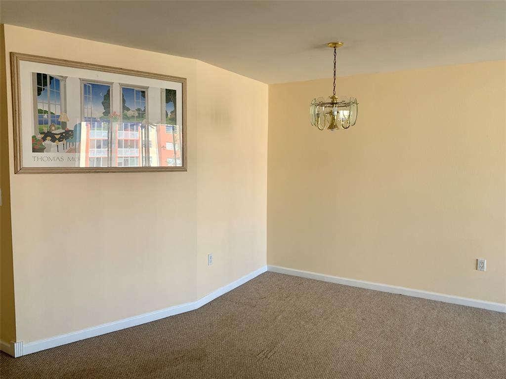 1710 Northeast 191st Street, Unit 4123 Miami, FL 33179 - Photo 7 of 17 a view of empty room with windows