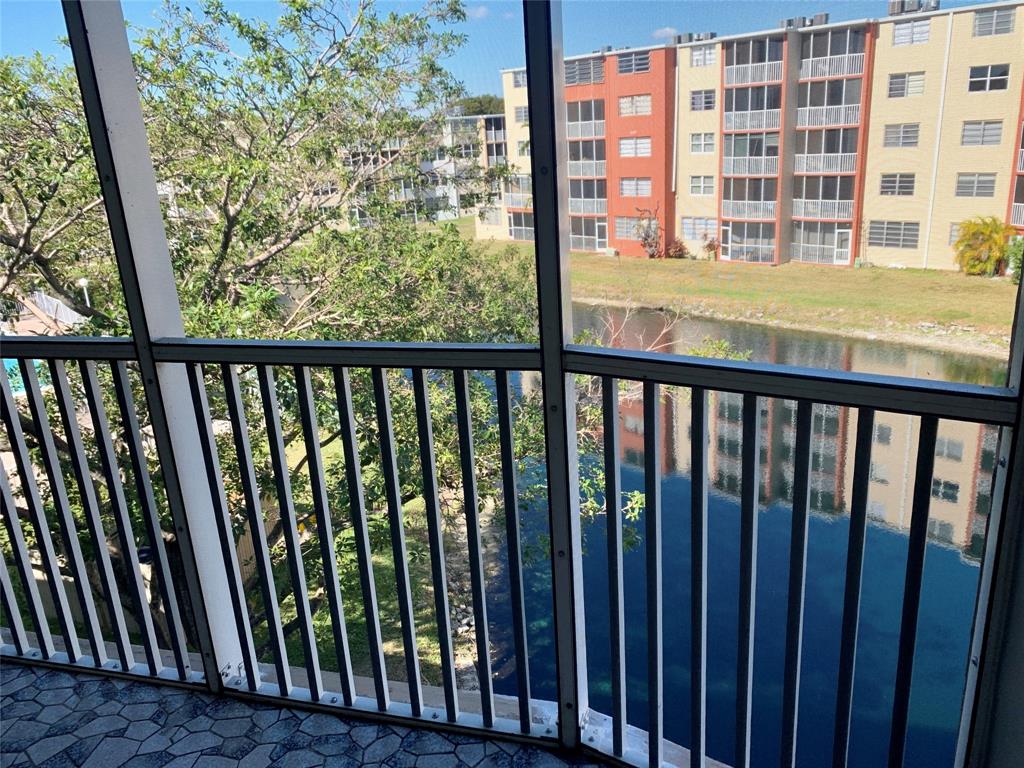1710 Northeast 191st Street, Unit 4123 Miami, FL 33179 - Photo 10 of 17 a view of a balcony with wooden floor