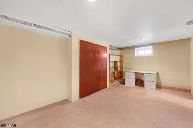a view of a livingroom with a furniture and a ceiling fan