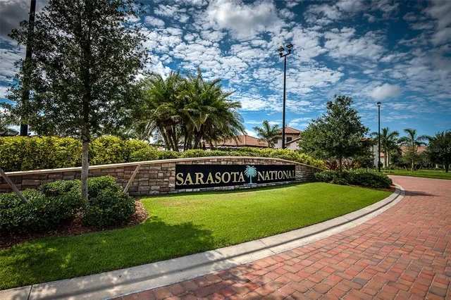 an aerial view of residential houses with outdoor space and river