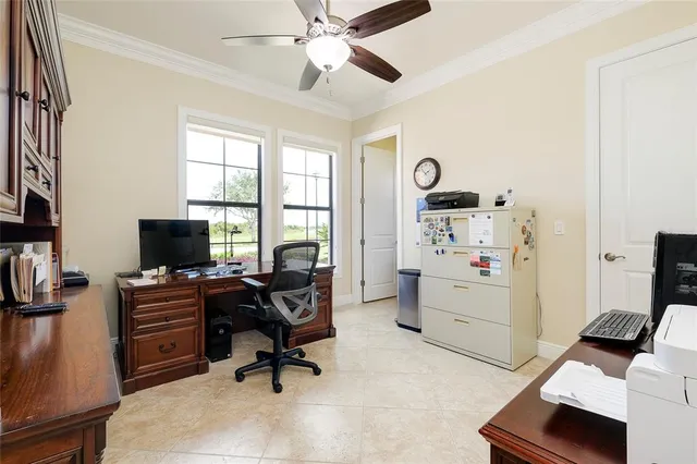 an aerial view of residential houses with outdoor space and ocean view