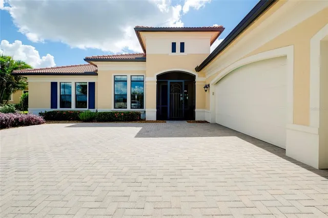 a living room with furniture fireplace and a large window