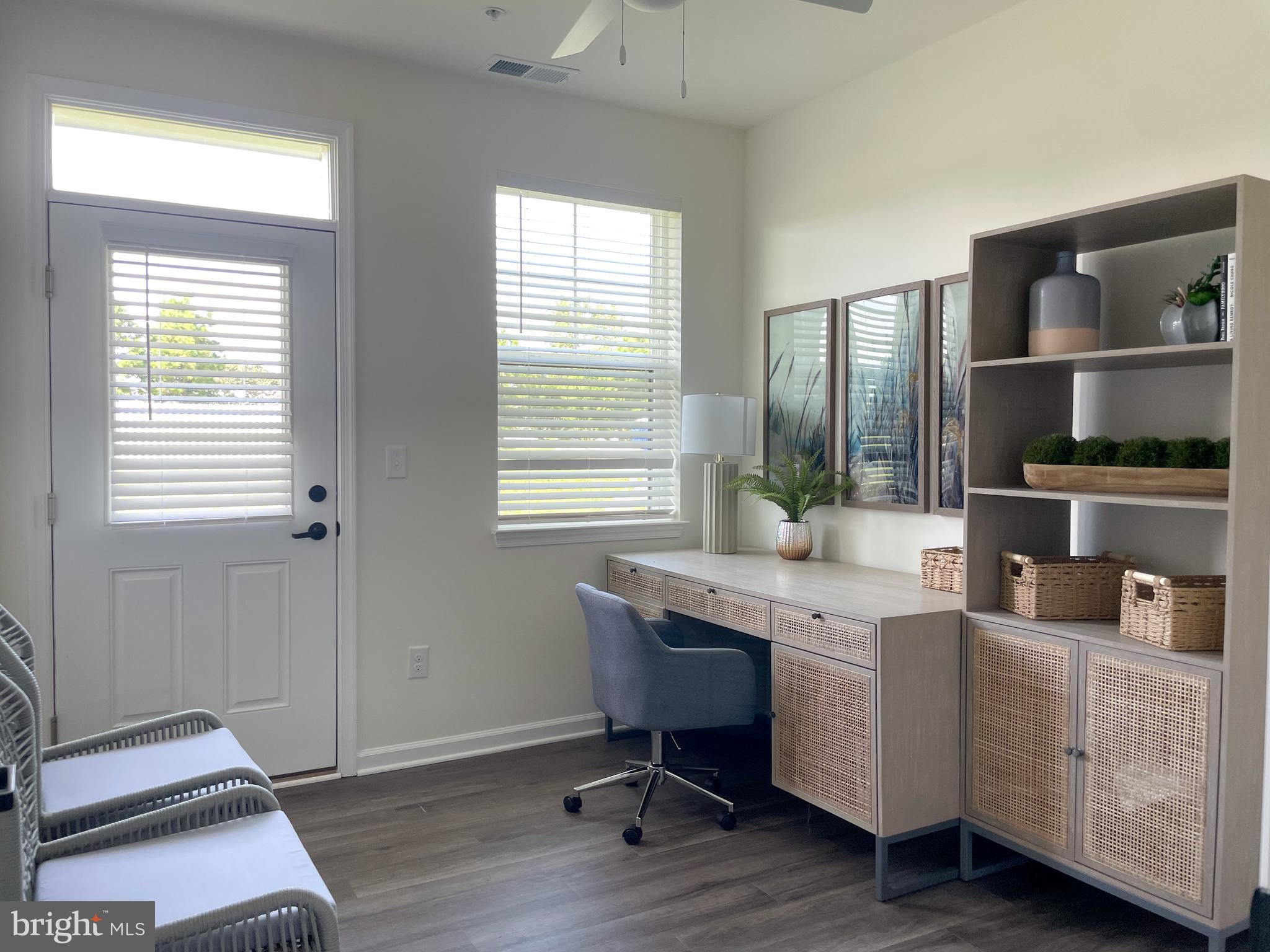 2105 Emden Lane, Unit 310 Lewes, DE 19958 - Photo 7 of 9 a view of a workspace with furniture and a window