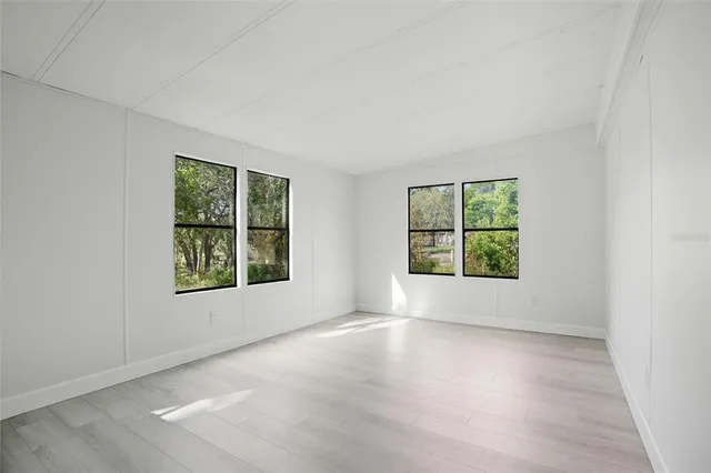 an empty room with windows