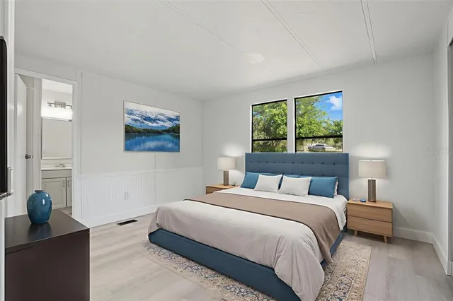 a bedroom with a bed and a dresser