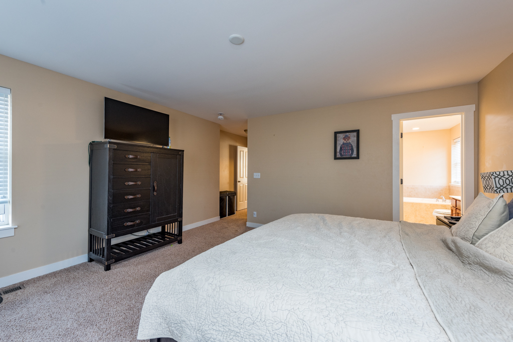 1004 Harris Road Grayslake, IL 60030 - Photo 11 of 24 a bedroom with a bed and a television