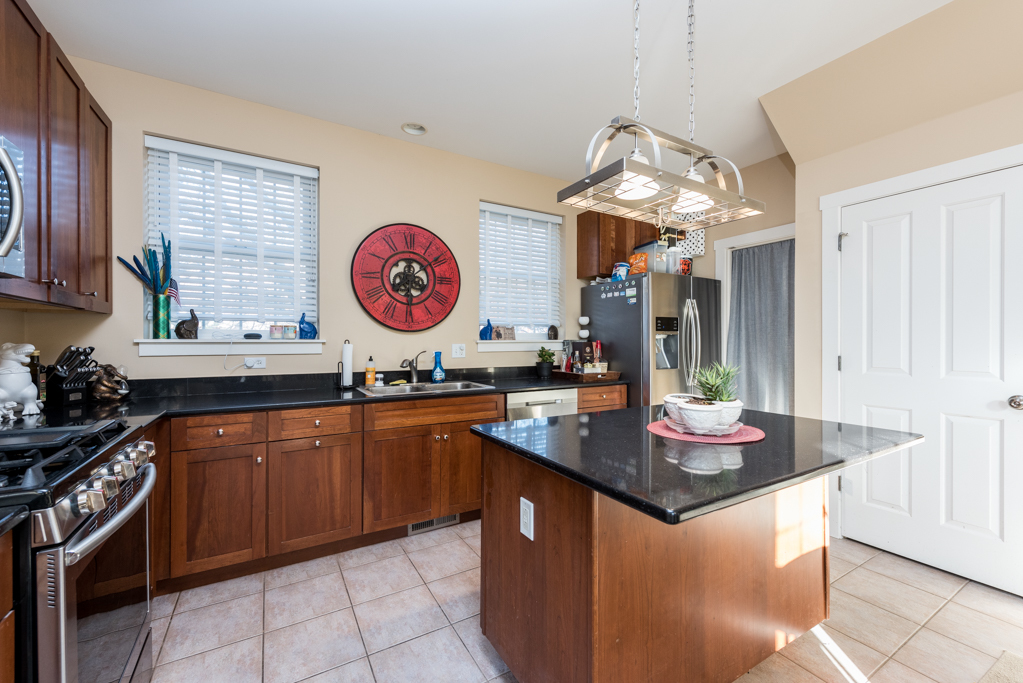 1004 Harris Road Grayslake, IL 60030 - Photo 8 of 24 a kitchen with stainless steel appliances granite countertop a sink and a stove