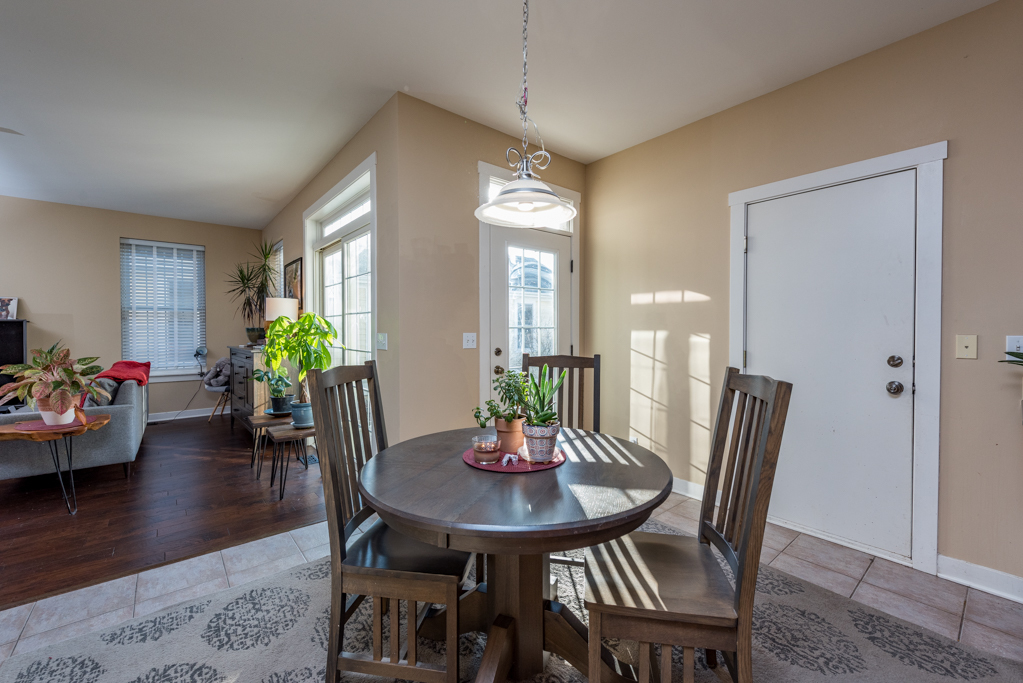 1004 Harris Road Grayslake, IL 60030 - Photo 9 of 24 a view of a dining room with furniture and wooden floor
