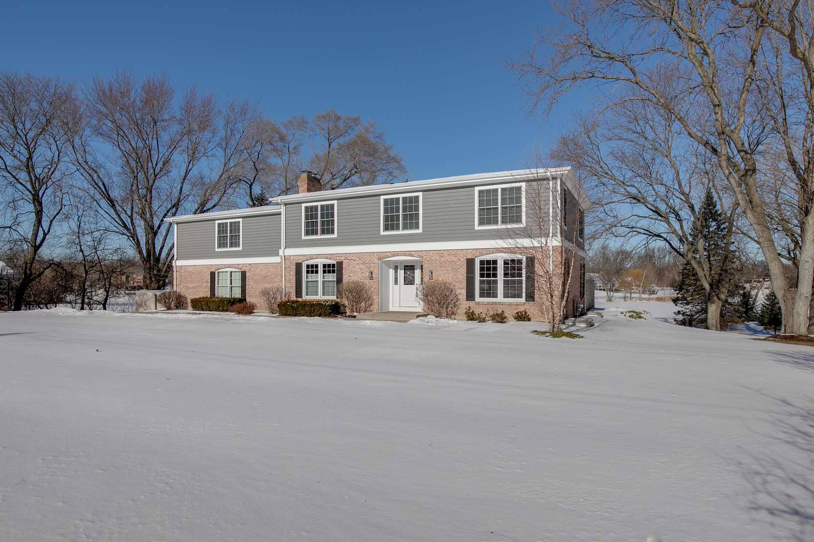 21242 West Long Grove Road Kildeer, IL 60047 - Photo 1 of 42 a front view of a house with a road