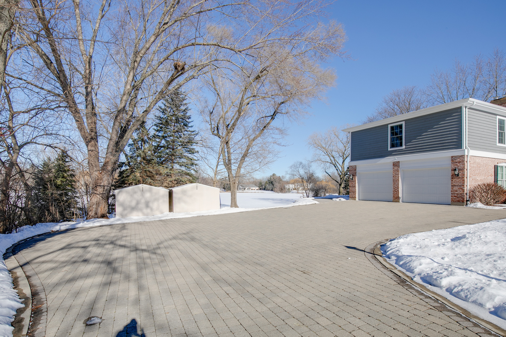 21242 West Long Grove Road Kildeer, IL 60047 - Photo 2 of 42 a street view covered with snow