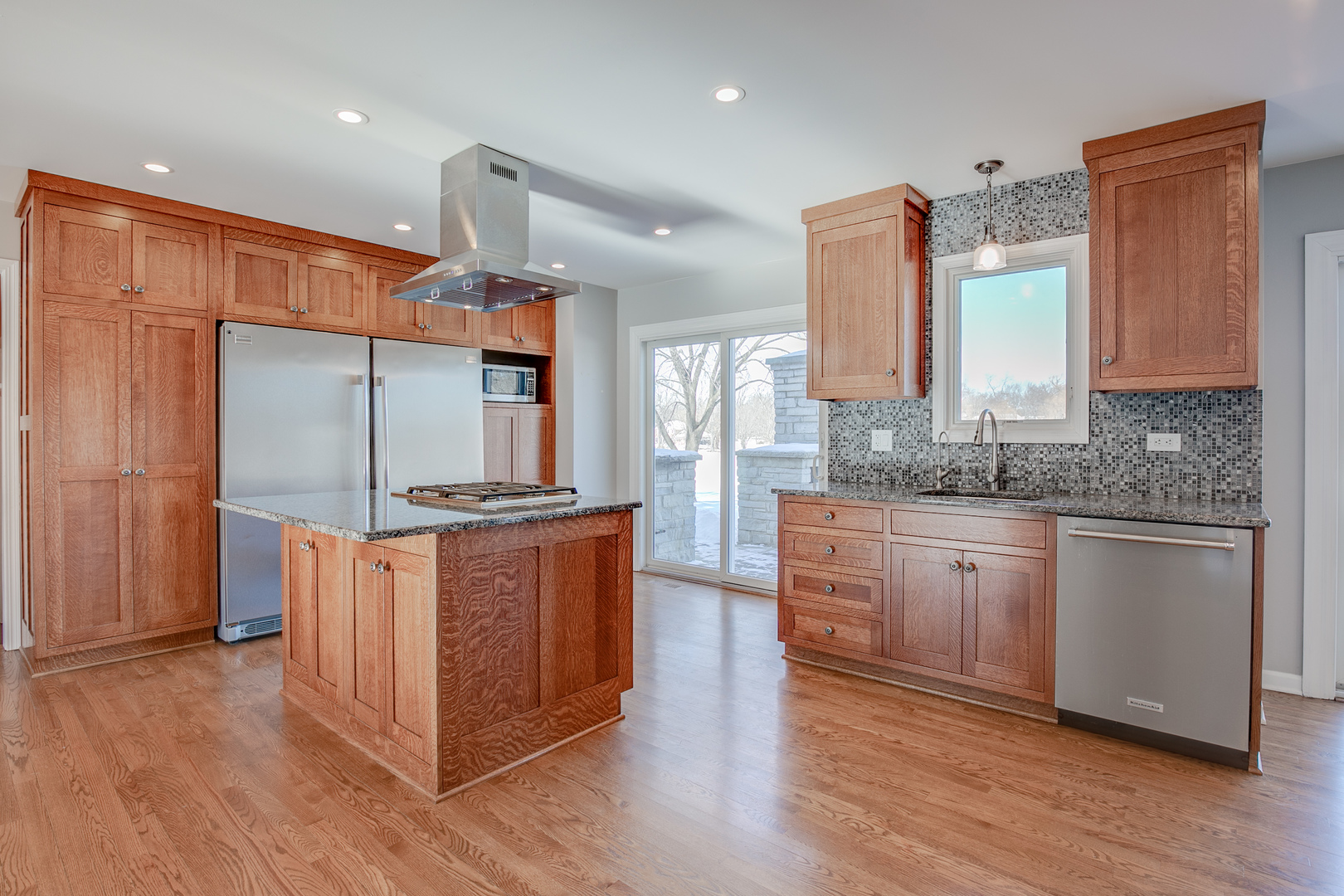 21242 West Long Grove Road Kildeer, IL 60047 - Photo 11 of 42 a kitchen with stainless steel appliances granite countertop wooden floors and sink