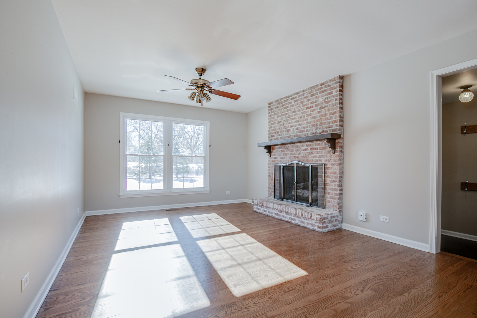 21242 West Long Grove Road Kildeer, IL 60047 - Photo 14 of 42 a view of an empty room with a window and fireplace