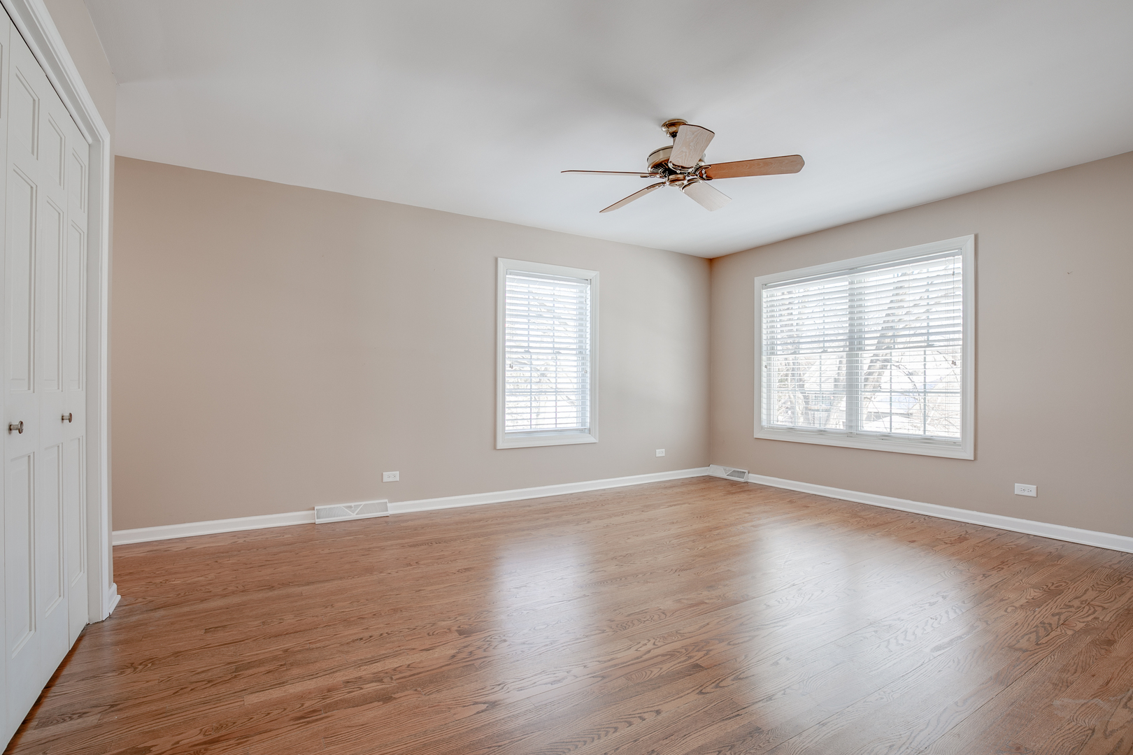 21242 West Long Grove Road Kildeer, IL 60047 - Photo 19 of 42 a view of an empty room with wooden floor and a window