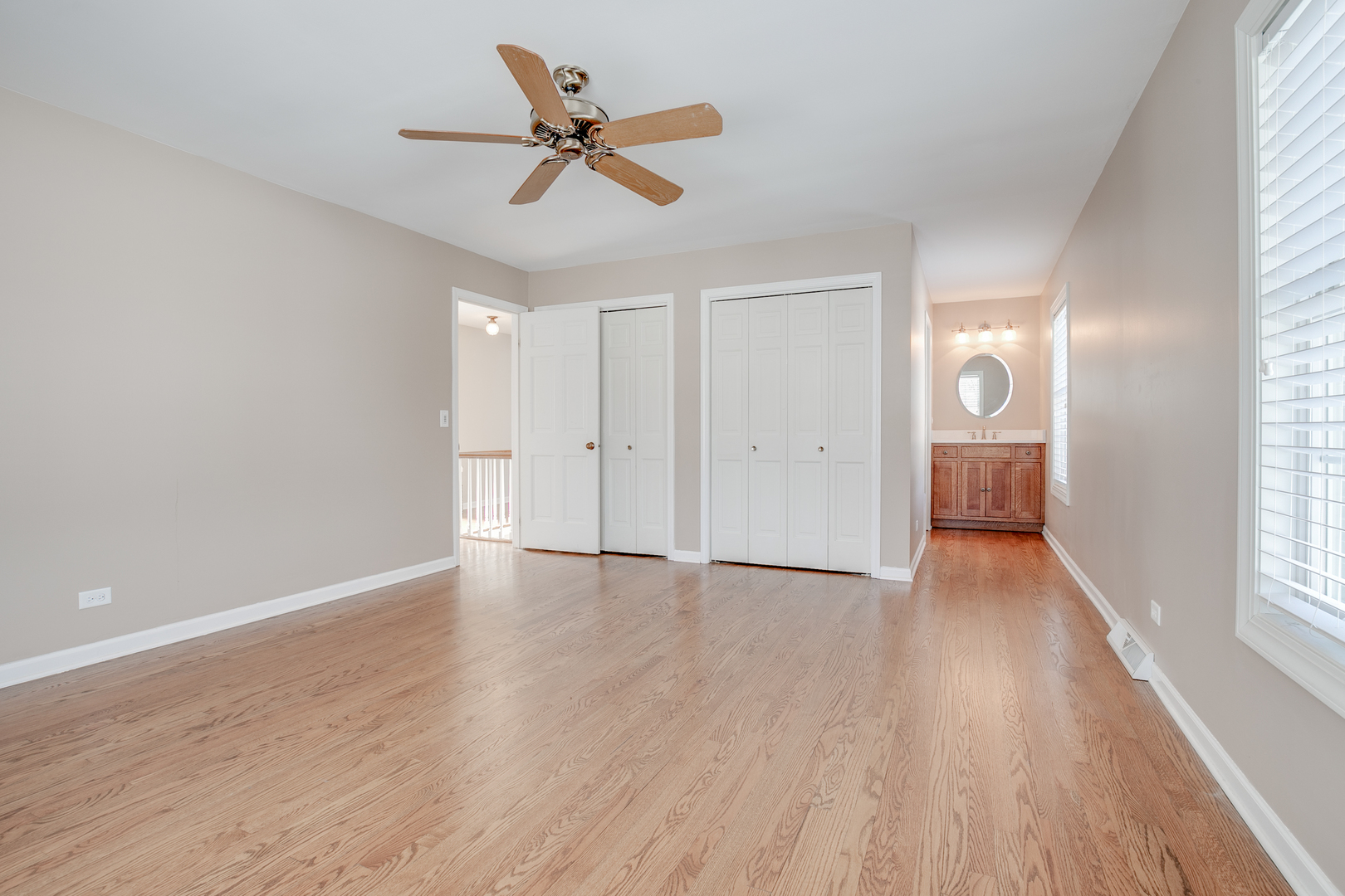 21242 West Long Grove Road Kildeer, IL 60047 - Photo 20 of 42 an empty room with wooden floor and windows