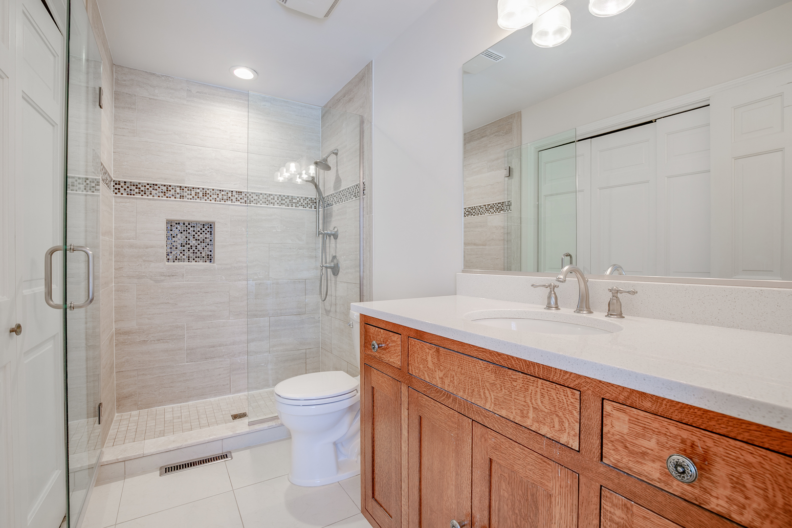 21242 West Long Grove Road Kildeer, IL 60047 - Photo 22 of 42 a bathroom with a sink a toilet and shower