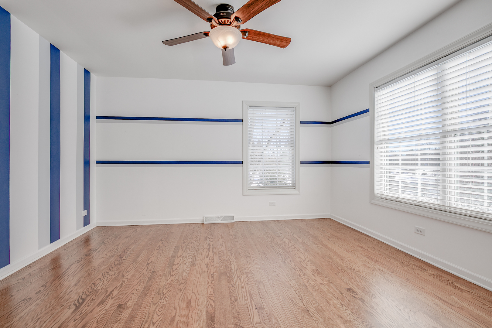 21242 West Long Grove Road Kildeer, IL 60047 - Photo 23 of 42 wooden floor in an empty room with a window