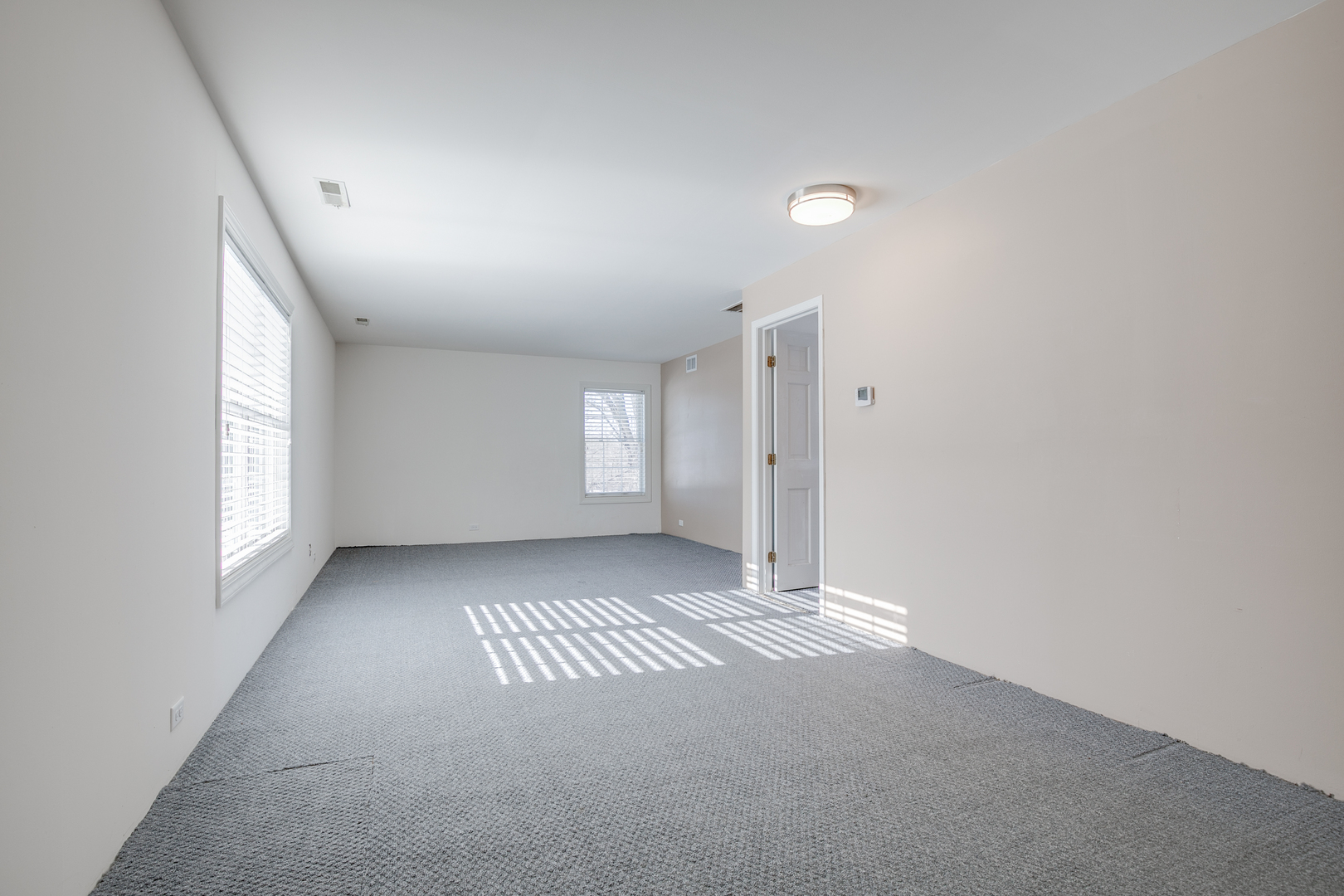 21242 West Long Grove Road Kildeer, IL 60047 - Photo 29 of 42 an empty room with windows