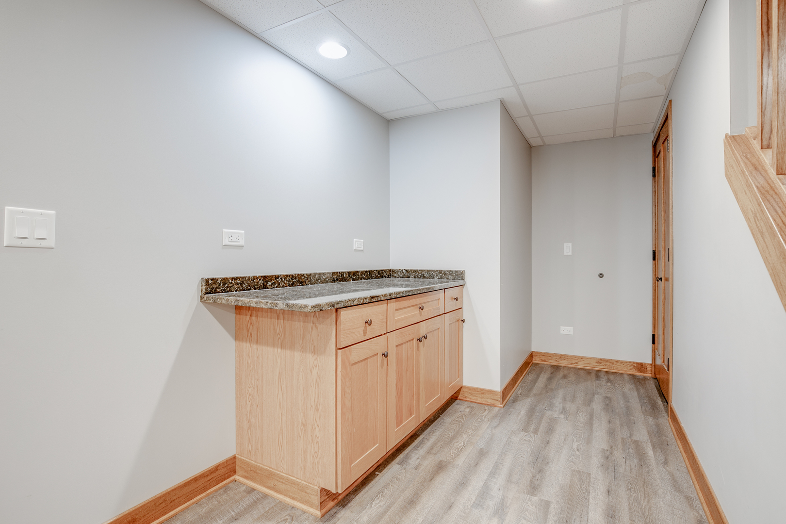 21242 West Long Grove Road Kildeer, IL 60047 - Photo 33 of 42 a view of a kitchen with white cabinets and wooden floor