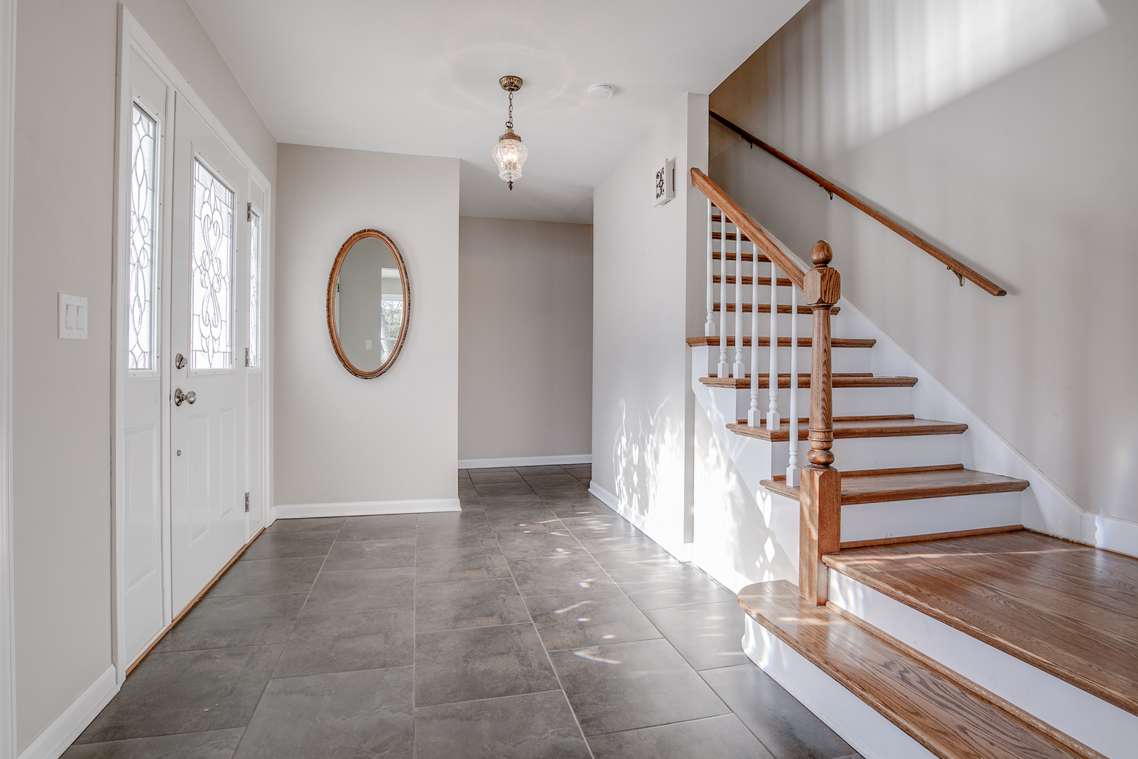 21242 West Long Grove Road Kildeer, IL 60047 - Photo 5 of 42 a view of a hallway with wooden floor and entryway