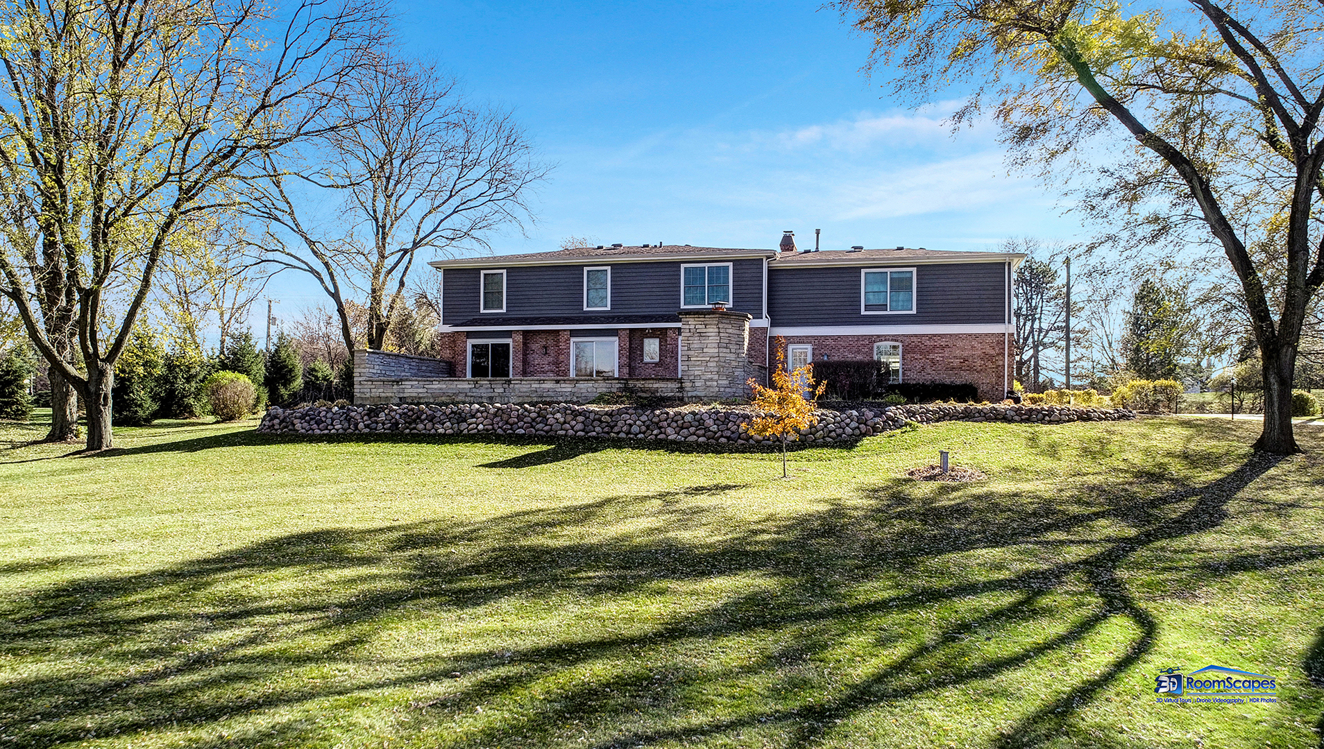 21242 West Long Grove Road Kildeer, IL 60047 - Photo 41 of 42 a front view of a house with a yard table and chairs