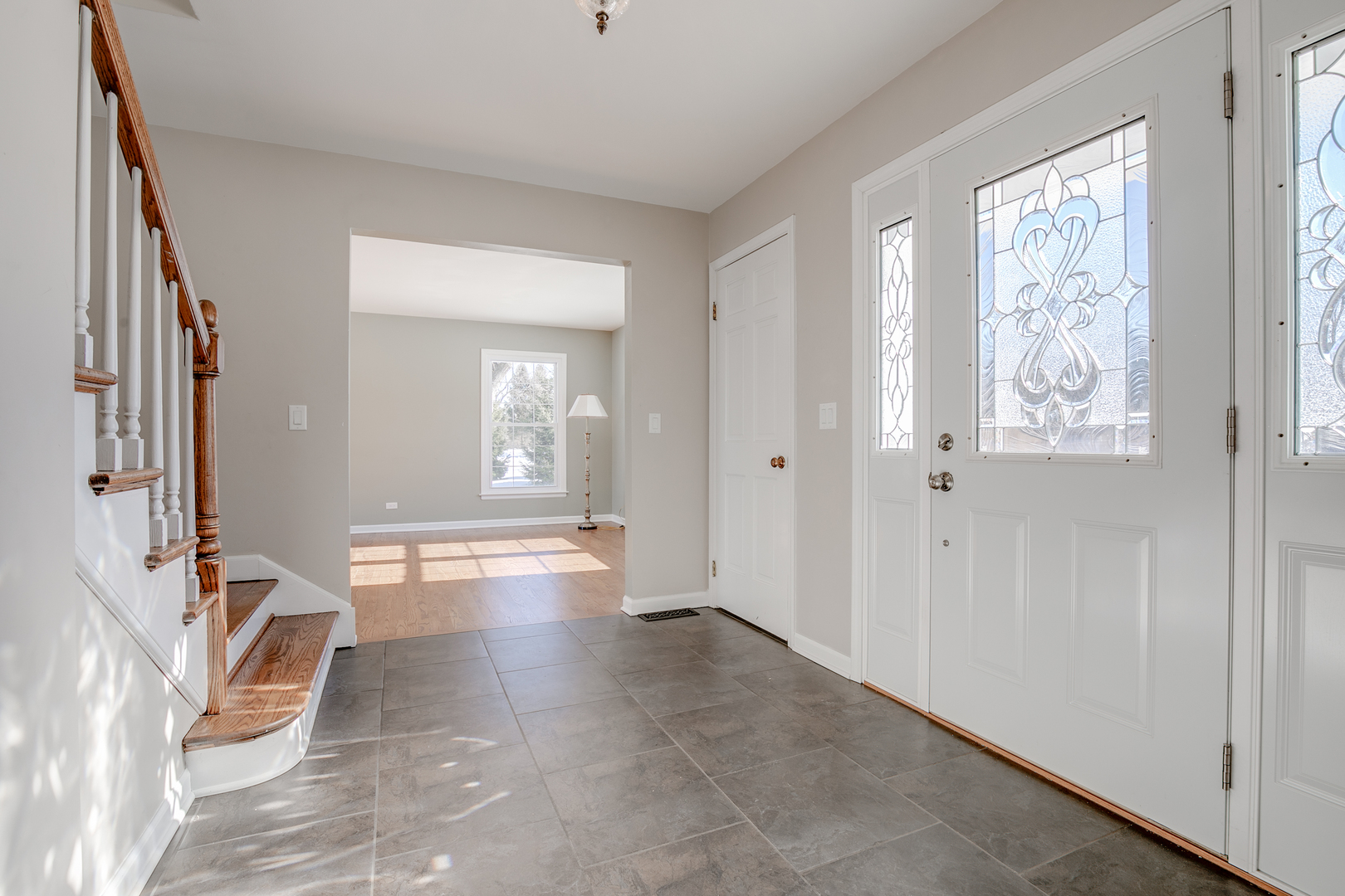 21242 West Long Grove Road Kildeer, IL 60047 - Photo 6 of 42 a view of a hallway to a livingroom with furniture