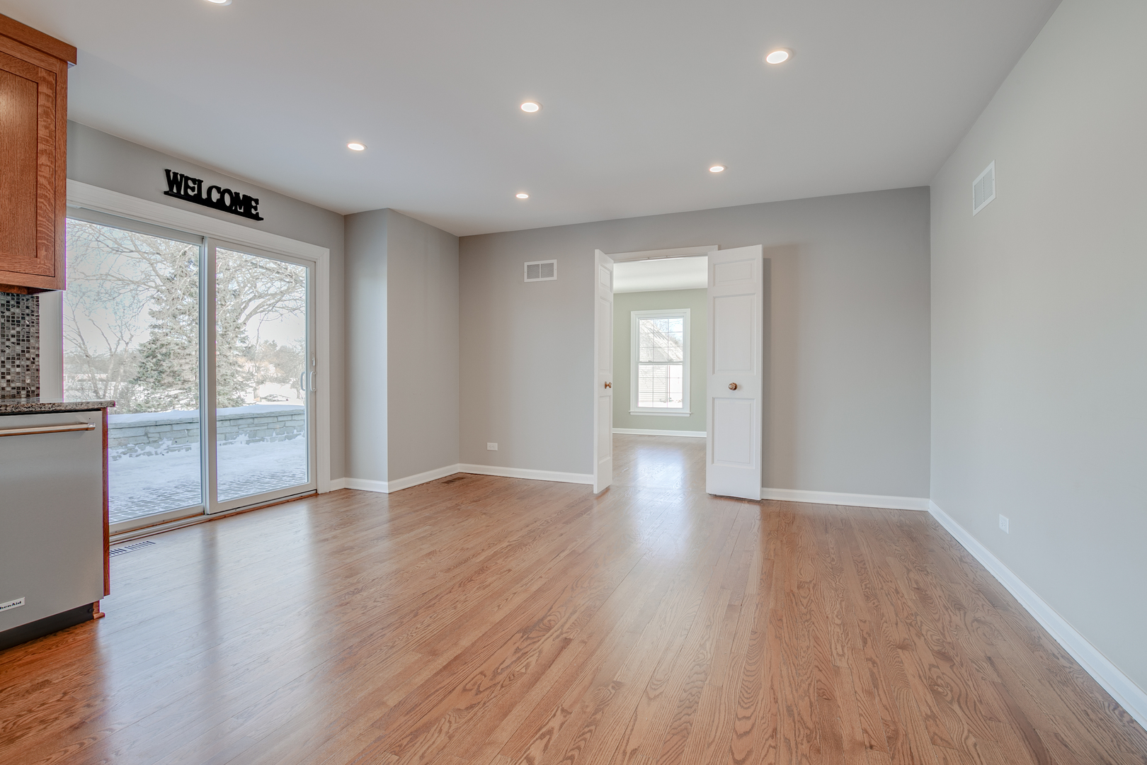 21242 West Long Grove Road Kildeer, IL 60047 - Photo 9 of 42 a view of an empty room with wooden floor and a window