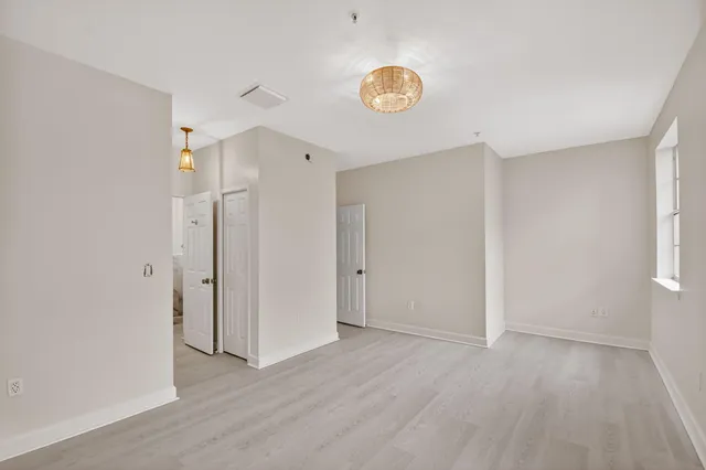 a view of a livingroom with wooden floor
