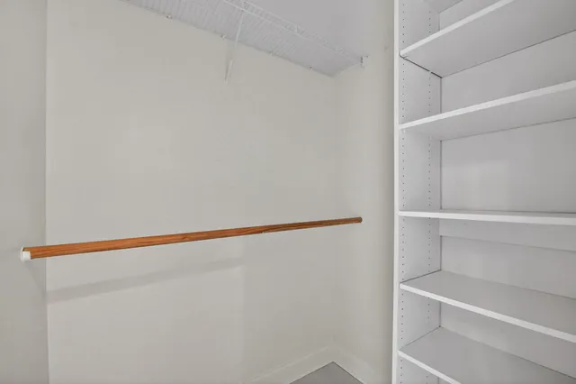 a view of an empty walk in closet
