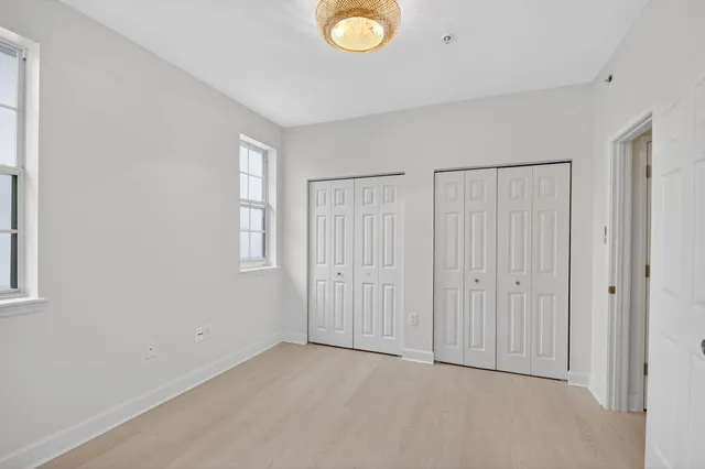 a bathroom with a granite countertop sink toilet and bathtub